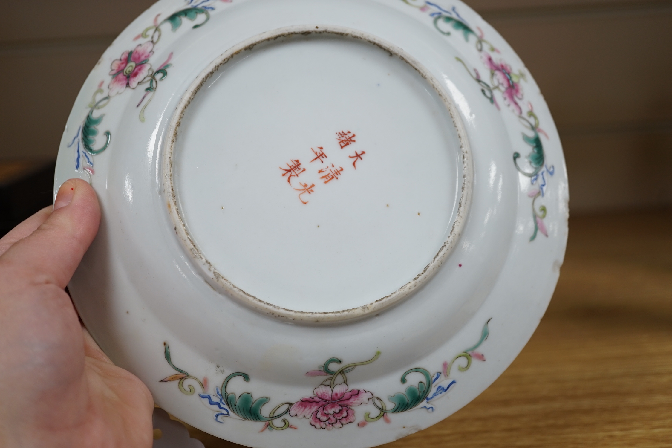 A Chinese blue and white dish and a similar enamelled dish, largest 20cm